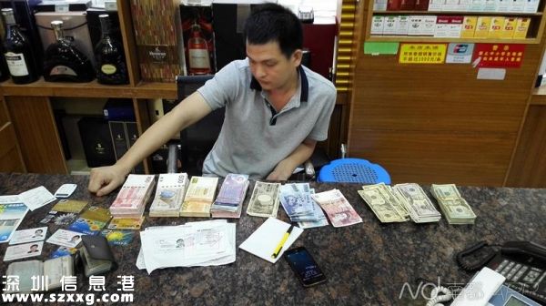 圖為<a href=http://www.zshb029.com/shenzhen/ target=_blank class=infotextkey>深圳</a>(www.zshb029.com)警方破獲重大地下錢(qián)莊案件中查獲的銀行卡及外幣