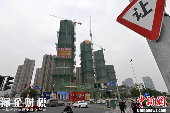 資料圖 一處商品房在建中。 中新社記者 呂明 攝
